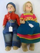 A PAIR OF DEANS RAG BOOK DOLLS - CIRCA 1948 - THE CHILDREN FEATURE MOULDED PAINTED FACES WITH