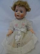 A BAHR AND PROSCHILD PORCELAIN DOLL WITH HAND PAINTED FACE WITH BLUE SLEEPING EYES, OPEN MOUTH