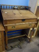 AN ANTIQUE PINE LIFT TOP WRITING DESK WITH FITTED INTERIOR COMPRISING SEVEN SMALL DRAWERS AND