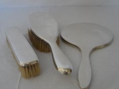 A SOLID SILVER BIRMINGHAM HALLMARKED SILVER DRESSING TABLE SET INCLUDING A HAIR BRUSH AND MIRROR