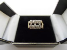 AN 18 CARAT GOLD AND SIX STONE DIAMOND RING, 3.5 PTS EACH, TOTAL 21 PTS APPROX. 9 GM