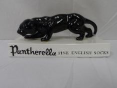 AN ADVERTISING PORCELAIN FIGURE OF A BLACK JAGUAR DEPICTING PANTHERELLA FINE ENGLISH SOCKS,