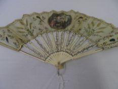 A CIRCA 1780 SILK AND IVORY BAPTISM FAN. THE MOUNT WITH CIRCULAR PRINT ON SILK DEPICTING A YOUNG
