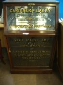 A VINTAGE GARDINER AND LACEY GLASS FRONTED MAHOGANY CHEMIST SHOP DISPLAY CABINET, THE CABINET HAVING