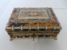 A TORTOISESHELL AND IVORY VELVET LINED ROSEWOOD JEWELLERY BOX, THE BOX HAVING APPLIED FILIGREE