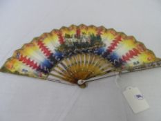 A CIRCA 1800 HAND PAINTED TORTOISESHELL AND MOTHER OF PEARL DOUBLE SIDED FAN. THE BRIGHTLY