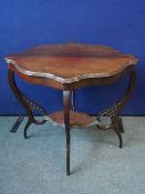 A VICTORIAN SCALLOPED EDGE OCCASIONAL TABLE WITH SHAPED LEGS AND FRET WORK PANELS, APPROX. 77 54