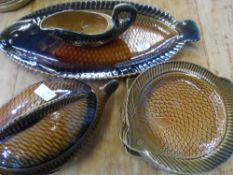 A PART SARREGUEMIMES POTTERY FISH DINNER SERVICE INCL. LIDDED TUREEN, FISH PLATTER, SAUCE BOAT AND