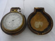 A SHORT AND MASON LONDON POCKET ALTIMETER GAUGE MADE FOR A & N C S LTD. WESTMINSTER, GILT CASED IN