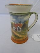 A ROYAL DOULTON CYLINDRICAL WATER JUG DEPICTING A COUNTRYSIDE SCENE, NUMBERED AND SIGNED TO BASE