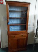 A VICTORIAN MAHOGANY GLAZED BOOKCASE, THREE SHELVES TO THE TOP, SINGLE DRAWER AND CUPBOARDS UNDER,