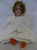 A HEINRICH HANDWERCK SIMON & HALBIG BISQUE HEADED DOLL , THE HAND PAINTED HEAD WITH BLUE SLEEPING