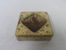 A ROYAL DOULTON STONEWARE SQUARE ASHTRAY DEPICTING LIONS, MADE FOR THE WEMBLEY EXHIBITION,THE