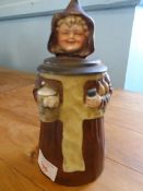 A PEWTER TOPPED GERMAN PORCELAIN BEER MUG IN THE FORM OF A NUN