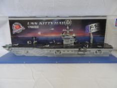 A LARGE LEGO MEGA BLOCK MODEL OF THE USS KITTY HAWK