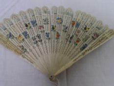 A CIRCA 1850 IVORY BRISE` FAN. THE IVORY GUARD AND FAN STICKS PIERCED IN THE FORM OF BRANCHES AND