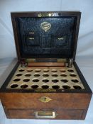 A WALNUT TRAVELLING BOX BY ALLSHORN 51 EDGWARE ROAD CONTAINING SEVEN STERILISED SURGICAL SUTURES