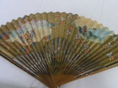 TWO CIRCA 1900 HAND PAINTED PAPER JAPANESE FANS. ONE PAINTED LACQUER HAVING A HAND PAINTED FRIEZE