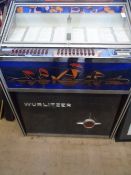 A WURLITZER JUKE BOX WITH SOME RECORDS, APPROX. 82 X 60 X 100 CM