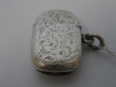 A SOLID SILVER CHESTER HALLMARKED VESTA DATED 1899.