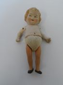 AN ANTIQUE MINIATURE BISQUE DOLL STAMPED I GERMANY D 830 WITH JOINTED LIMBS APPROX. 17 CM