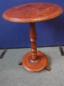 A VICTORIAN MAHOGANY WINE TABLE ON TURNED COLUMN WITH TRIPOD BASE