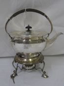A SOLID SILVER SHEFFIELD HALLMARKED SPIRIT KETTLE ON A SOLID SILVER TRIPOD BASE WITH SCROLL FEET,