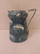 A BLUE TRANSFERRED STONE WARE WATER JUG DEPICTING VARIOUS AMERICAN HISTORICAL SCENES - BY THE