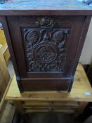 A CARVED OAK COAL CABINET