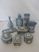 A MISC. COLLECTION OF WEDGWOOD BLUE JASPER WARE INCL. FOUR LIDDED BOXES, DECANTER, THREE VASES AND A