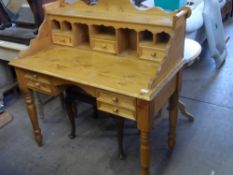 A PINE WRITING DESK WITH GALLERY, THE DESK HAVING THREE DRAWERS TO TOP, TWO DRAWERS TO SIDES ON