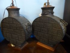 A PAIR OF CYLINDRICAL BRONZE ORIENTAL VASES CONVERTED TO LAMP  STANDS, THE VASES HAVING PANELLED