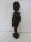 AN INDONESIAN CARVED HARD WOOD FIGURE OF A LADY, APPROX. 54 CM