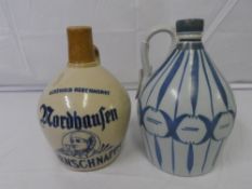 AN EGGSHELL BLUE GLAZED POTTERY SPIRIT BOTTLE, HAND PAINTED WITH THISTLE AND BLUE RIBBON