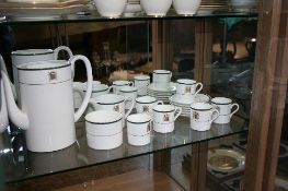 A PART WEDGWOOD HOUSE OF COMMONS BONE CHINA SET COMPRISING COFFEE POT ( NO LID ), SIX COFFEE CANS