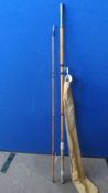 A VINTAGE TWO PIECE CANE FISHING ROD