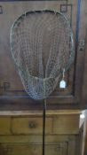 A VINTAGE CANE AND BRASS LANDING NET