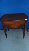 A REPRODUCTION OVAL MAHOGANY PEMBROKE TABLE FITTED WITH ONE DRAWER ON TAPERED LEGS MADE BY STRONGBOW