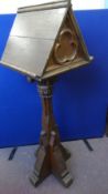 A VICTORIAN CARVED OAK LECTERN HAVING A DOUBLE SIDED BOOK REST, APPROX. 51 X 52 X 150 CCM