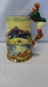 A CONTINENTAL MUSICAL BEER MUG DEPICTING A LAKESIDE SCENE HAVING A HANDLE IN THE FORM OF A GENTLEMAN