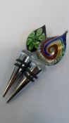 A PAIR OF LATE 20th CENTURY MURANO GLASS AND CHROME BOTTLE STOPPERS, THE FLAME FORM FINIALS IN