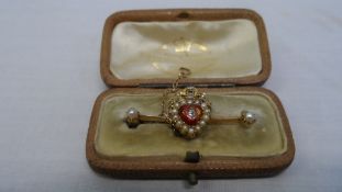 AN ANTIQUE YELLOW GOLD, ENAMEL, PEARL AND DIAMOND SWEETHEART BROOCH, THE RED ENAMEL HEART SHAPED