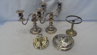 A MISC. COLLECTION OF SILVER PLATE INCL. CANDLESTICKS, MUFFIN DISH ETC.