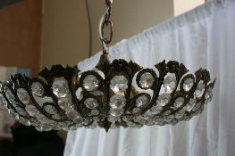 A BRASS AND CRYSTAL CHANDELIER TOGETHER WITH A BRASS AND CRYSTAL CENTRE LIGHT FITTING  ( 2 )