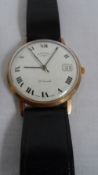 A GENT`S 9ct GOLD ROTARY 21 JEWEL WRISTWATCH ON A BLACK LEATHER STRAP