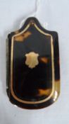 AN ANTIQUE TORTOISESHELL AND IVORY WRITING SLATE WITH BEVEL COMPACT MIRROR, THE SHIELD SHAPED