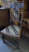 A MAHOGANY NURSERY / HALL CHAIR ON BARLEY TWIST SUPPORTS AND LEGS HAVING A CARVED BACK AND