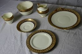 A PART ROYAL DOULTON  IVORY AND GILT TEA SET COMPRISING TWELVE SAUCERS, ELEVEN TEA CUPS, SLOP