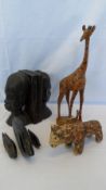 A MISC. COLLECTION OF CARVED WOODEN AFRICAN ARTIFACTS INCL. BOOKENDS DEPICTING A TRIBAL WOMAN, THREE