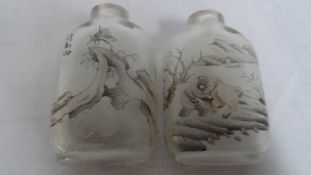 A PAIR OF CIRCA 1870 CHINESE INSIDE PAINTED SNUFF BOTTLES, BOTH BOTTLES DEPICTING AN  INSECT ON A